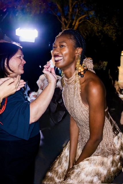 Backstage touch-up before a runway show